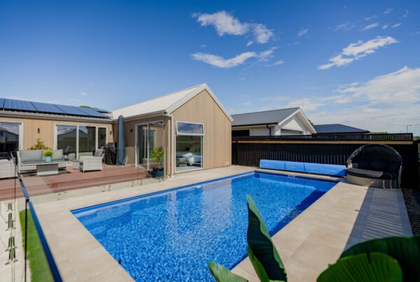 Backyard pool and outdoor living area in a bespoke new build home, demonstrating high quality residential construction and outdoor space integration.