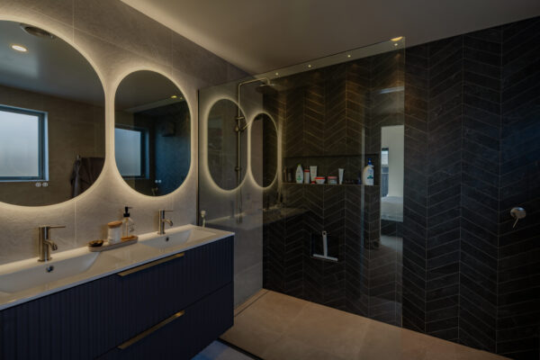 Modern bathroom interior in a bespoke new build home, showcasing high end renovations, architectural build detailing, and quality construction management by a New Zealand home builder.