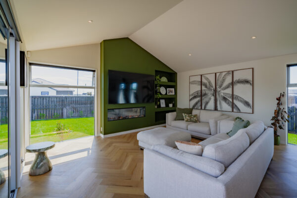 Contemporary living room with bespoke architectural design, representing high quality building construction and new housing developments managed by an experienced home builder company.
