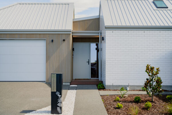 Front entrance of an architecturally designed new build house, reflecting professional building inspection standards, architectural build quality, and residential construction expertise.