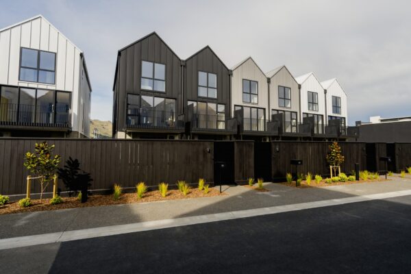 Contemporary townhouse exterior within a new housing development, highlighting architectural homes, new build houses, and large scale construction projects in NZ.