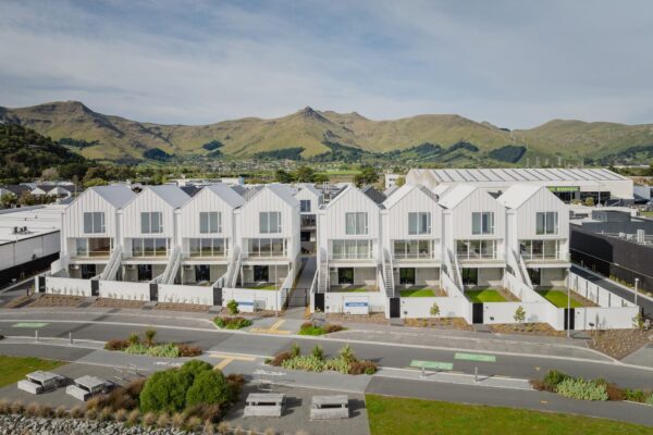 A row of modern townhouses in a new build development, showcasing architecturally designed homes, new build houses, Design and build excellence, home construction quality and construction NZ expertise across residential construction projects.