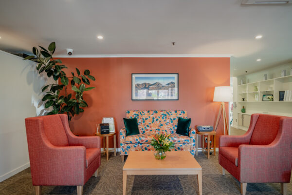 Warm and welcoming communal lounge inside an aged care facility, highlighting aged care construction, interior fit out quality, and thoughtful building design.