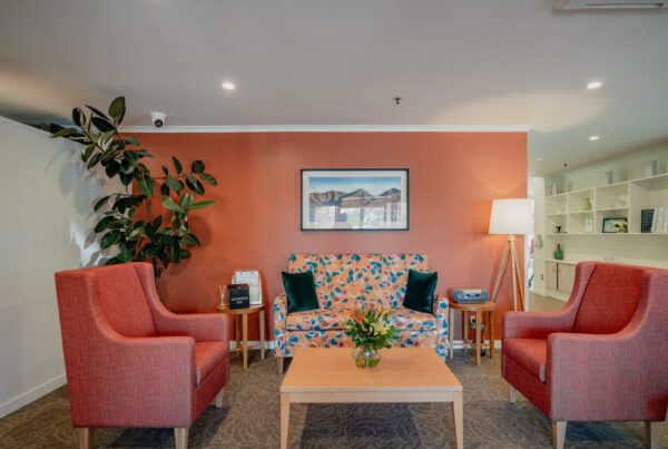 Warm and welcoming communal lounge inside an aged care facility, highlighting aged care construction, interior fit out quality, and thoughtful building design.