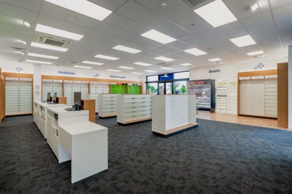 A retail pharmacy interior with new shelving and display areas arranged for Medicines, Natural Health and Beauty products, demonstrating Commercial Construction, commercial fit out work and construction NZ project management.